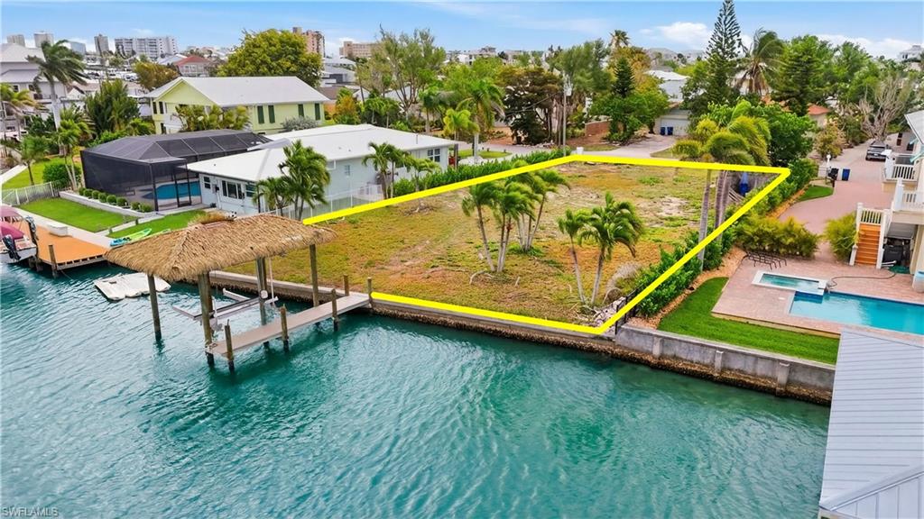 View from above of property with a large body of water - Virtually Edited Image