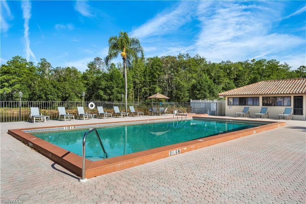 Community pool with a patio area