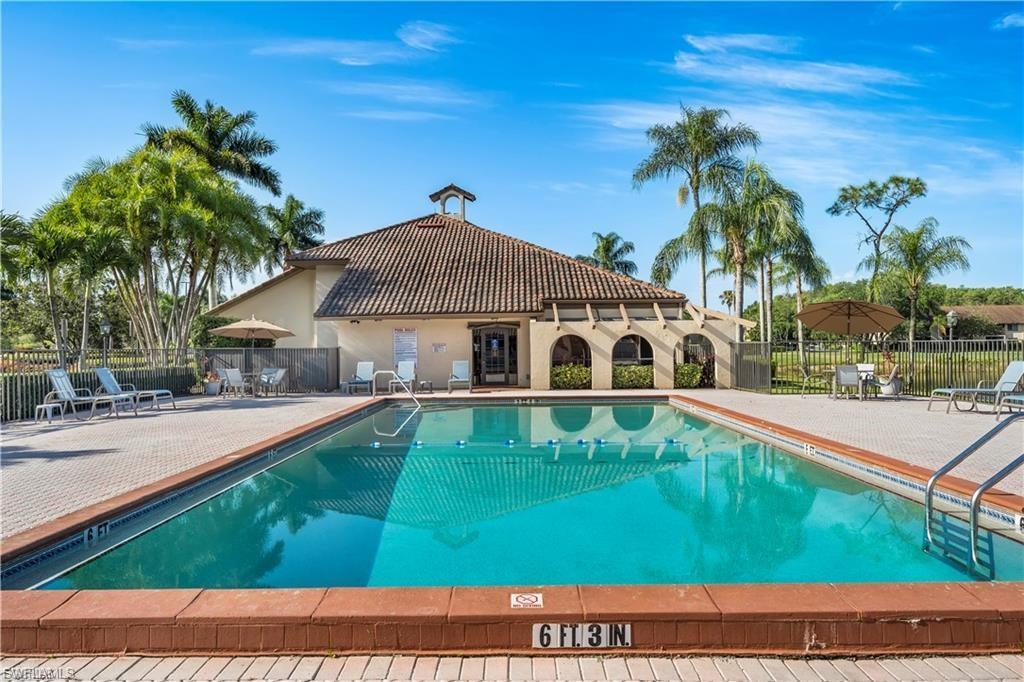 Community pool with a patio area
