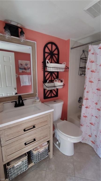 Bathroom featuring vanity, shower / bath combo with shower curtain, and light tile patterned floors