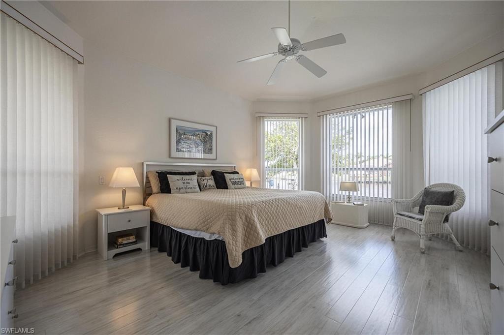 Bedroom with wood finished floors and ceiling fan