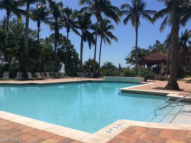 Community pool with a patio and a gazebo