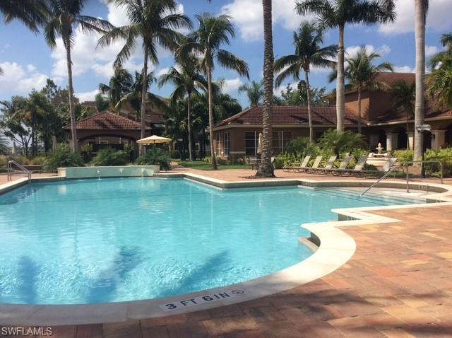 Community pool featuring a patio