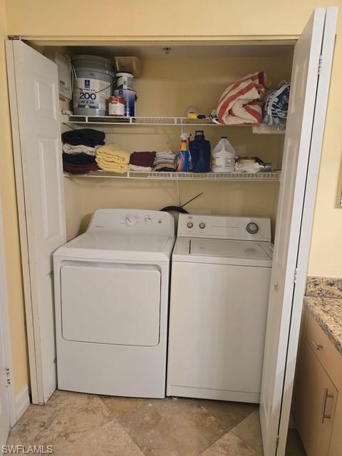 Laundry area featuring washing machine and clothes dryer