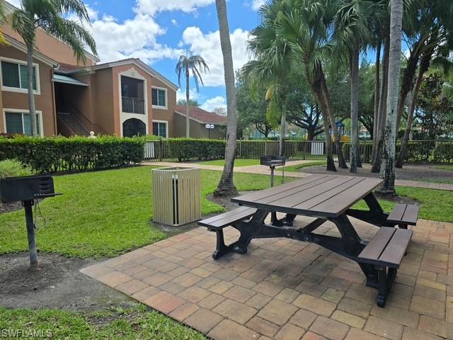View of property's community featuring a patio and outdoor dining area