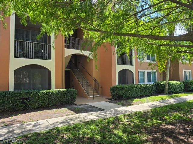 View of apartment building / complex with stairs