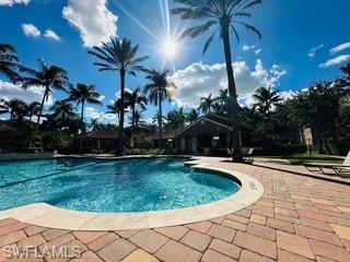 Community pool with a patio area