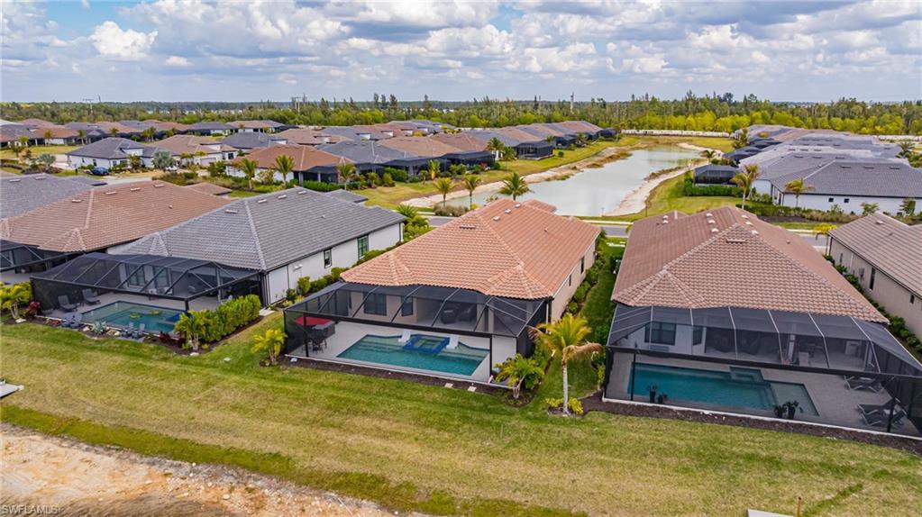 Aerial perspective of suburban area with a pool