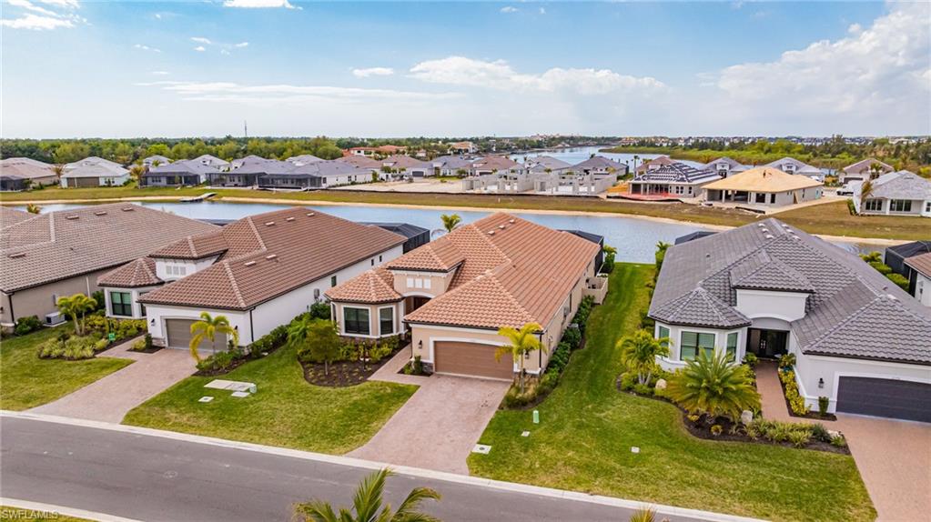 Aerial perspective of suburban area with a large body of water