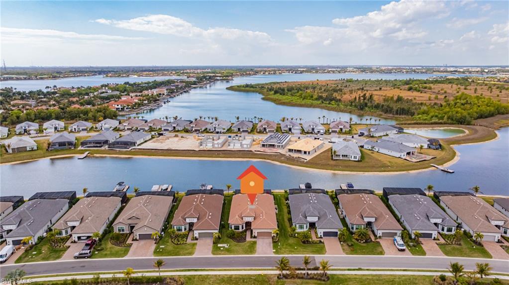 Aerial view of residential area with a large body of water