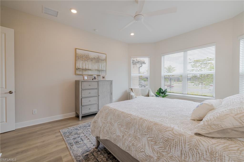 Bedroom with recessed lighting, light wood-style floors, and ceiling fan