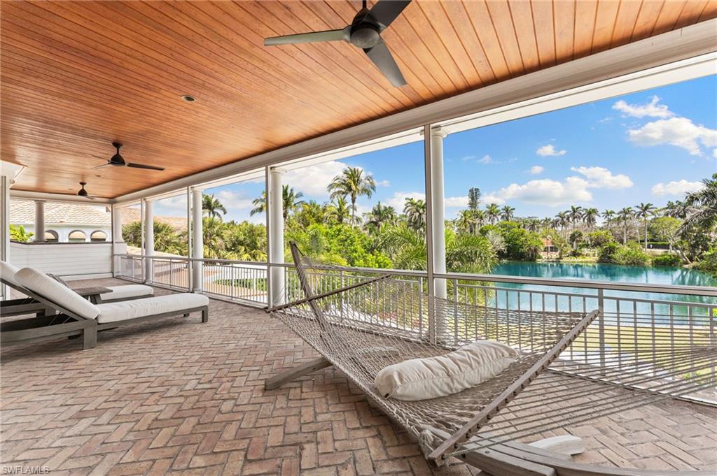 View of patio / terrace featuring a water view and ceiling fan