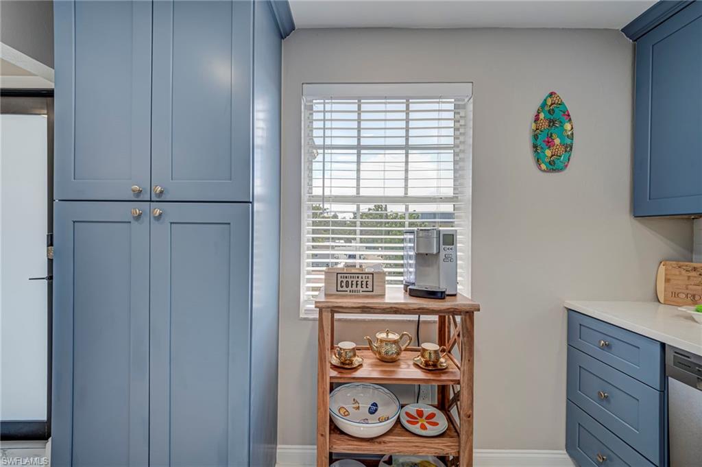 built in pantry and coffee bar with storage