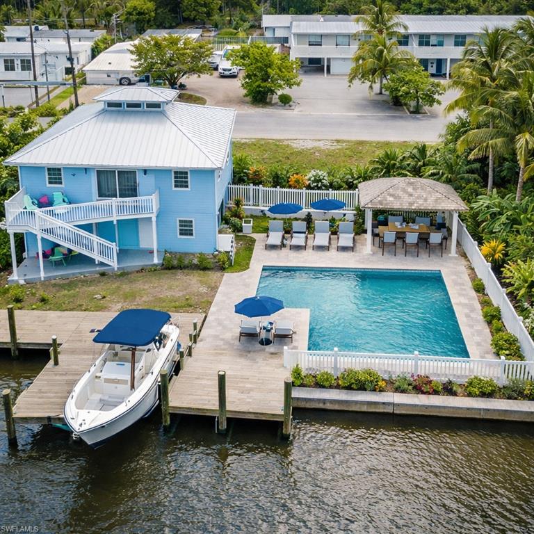 AI generated pool area  and dock with boat lift