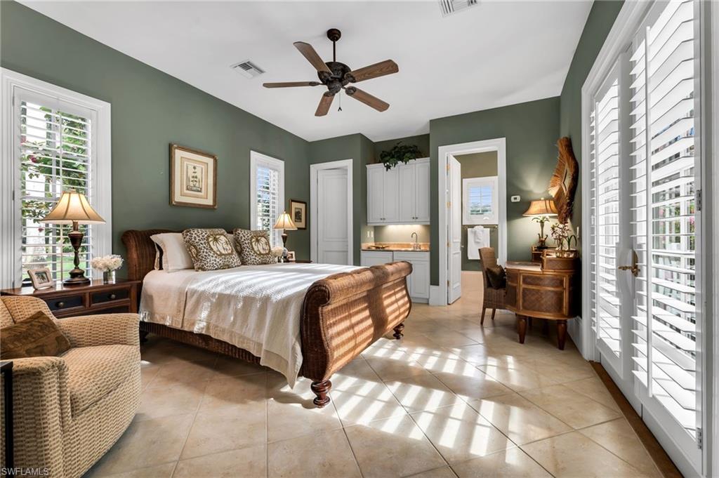 Cabana guest room with kitchenette and French doors that open out to the courtyard pool.  Your guests will never want to leave!