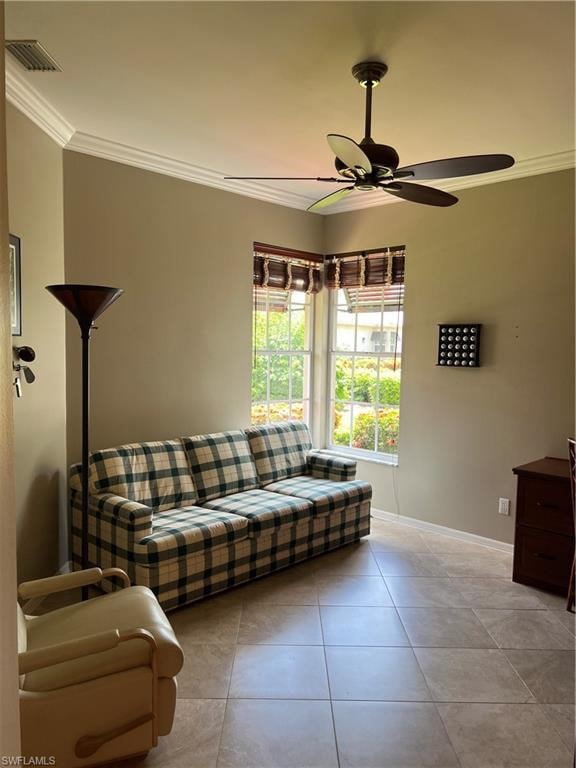 Bright, light-filled room featuring tile flooring, a ceiling fan with dark finish, large windows with natural light, and neutral wall finishes