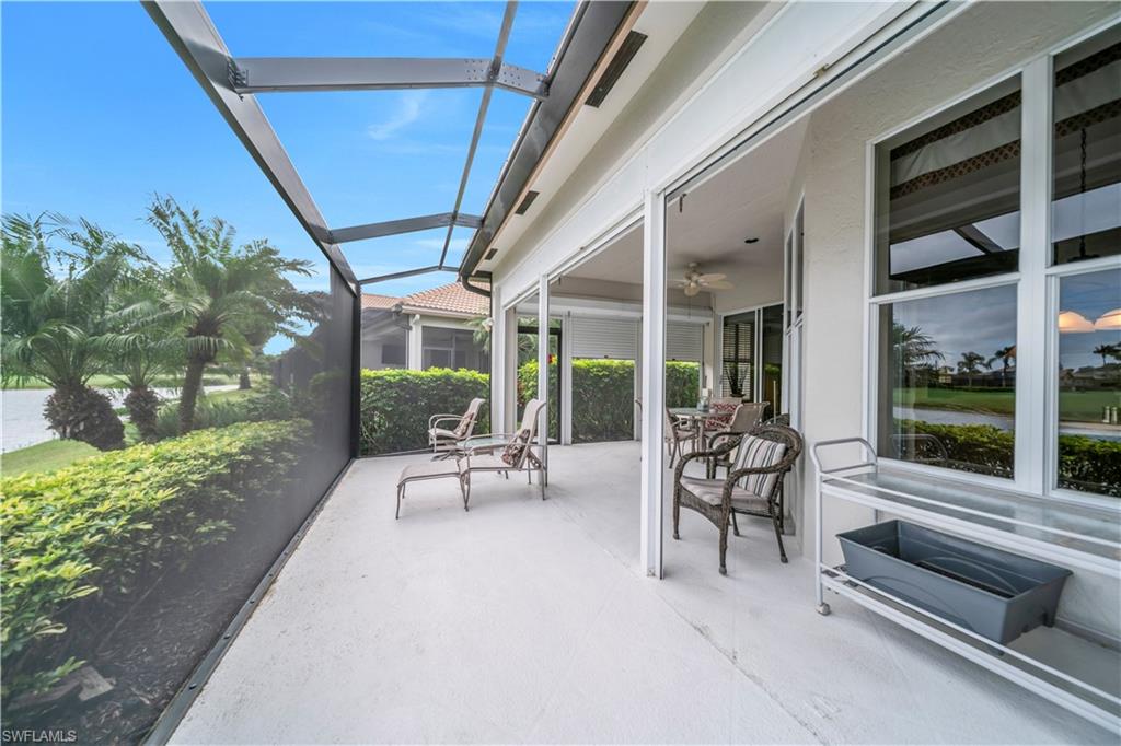 View of patio / terrace featuring a sunroom, a lanai, and ceiling fan