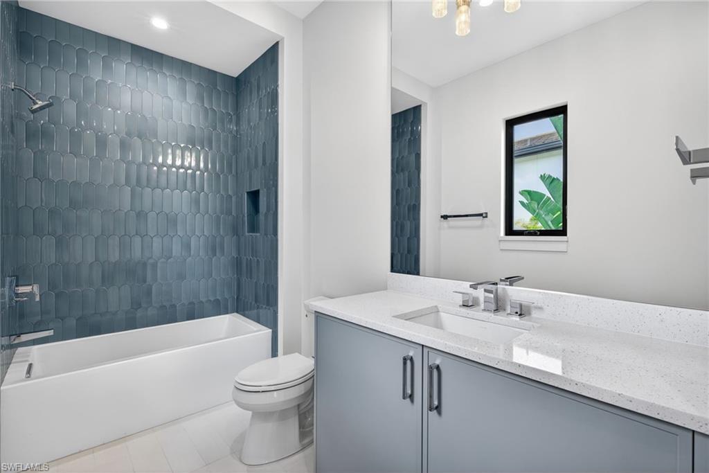 Bathroom 3  has beautiful tile shower and tub combination