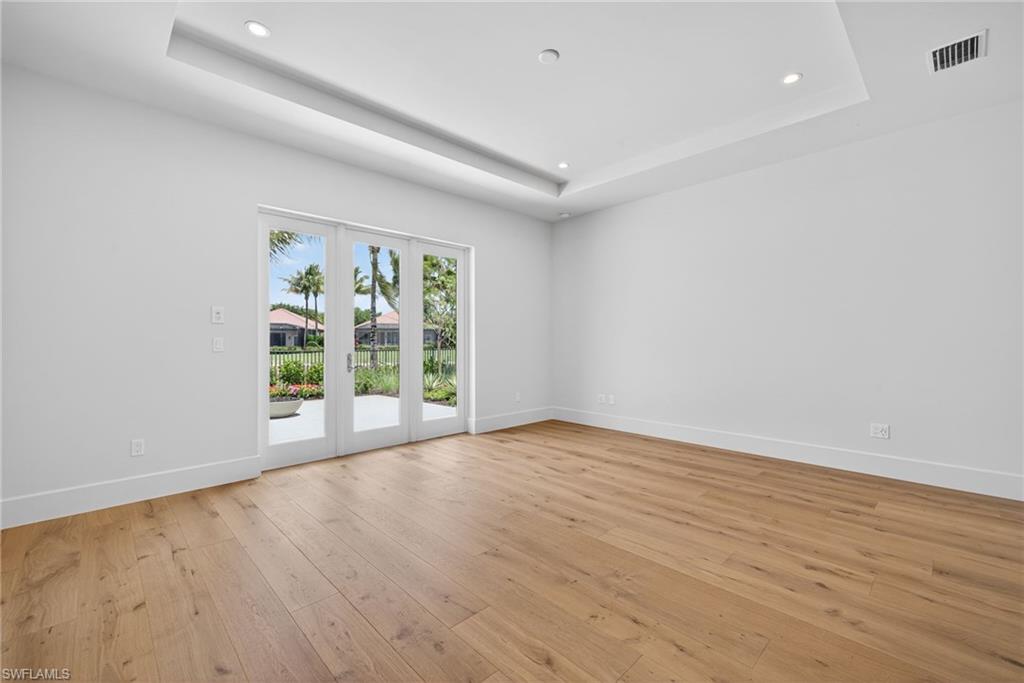 Master bedroom features french doors leading to  private terrace with gas fire pit
