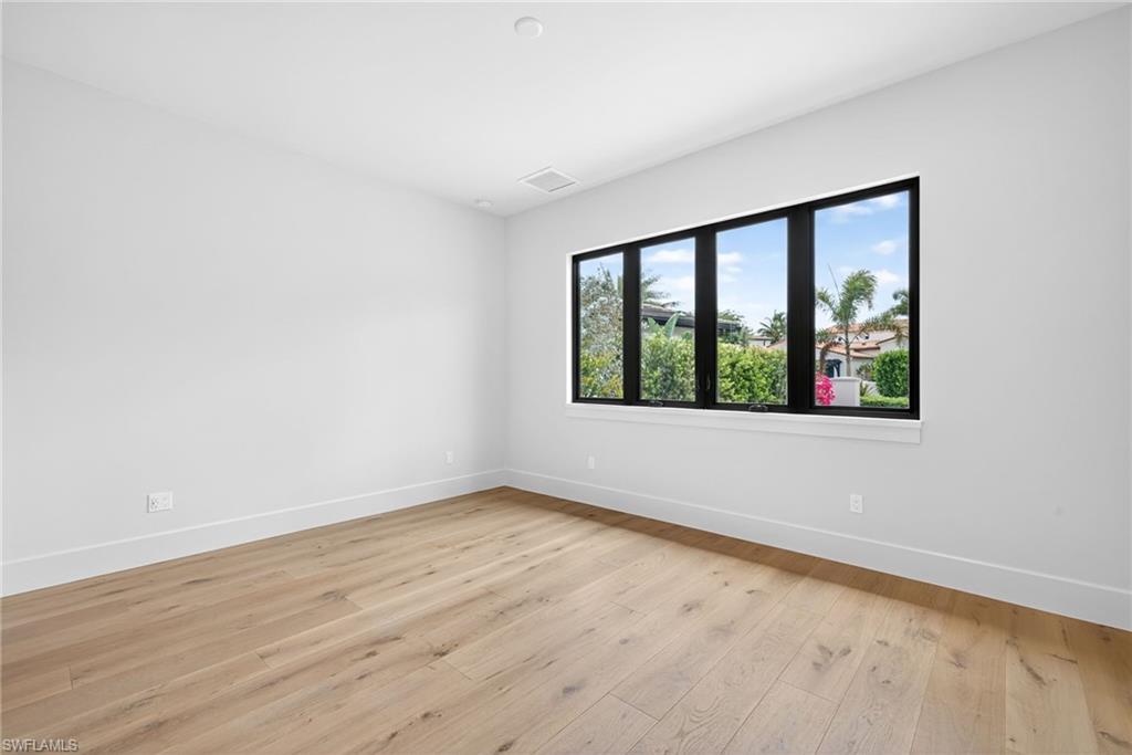 Bedroom 2 room featuring light wood floors and large window for lots of natural light