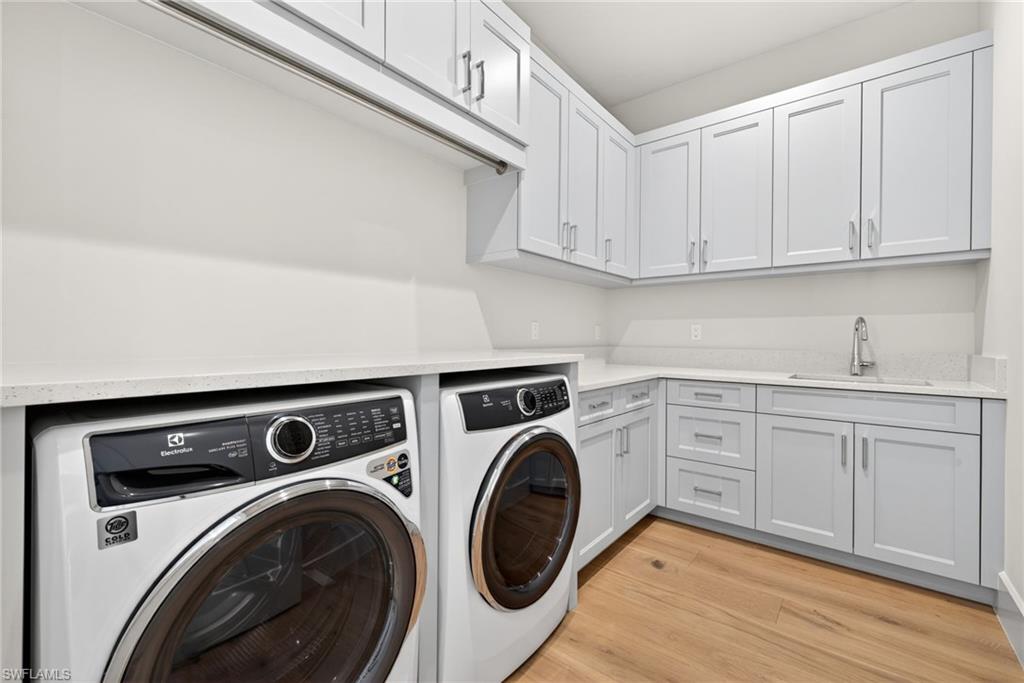 Large laundry room with lots of extra cabinets