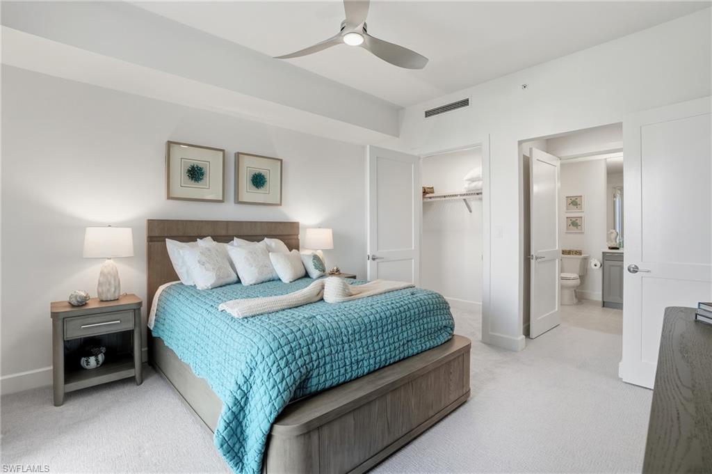 Bedroom featuring carpet, a closet, and ceiling fan - Virtually Edited Image