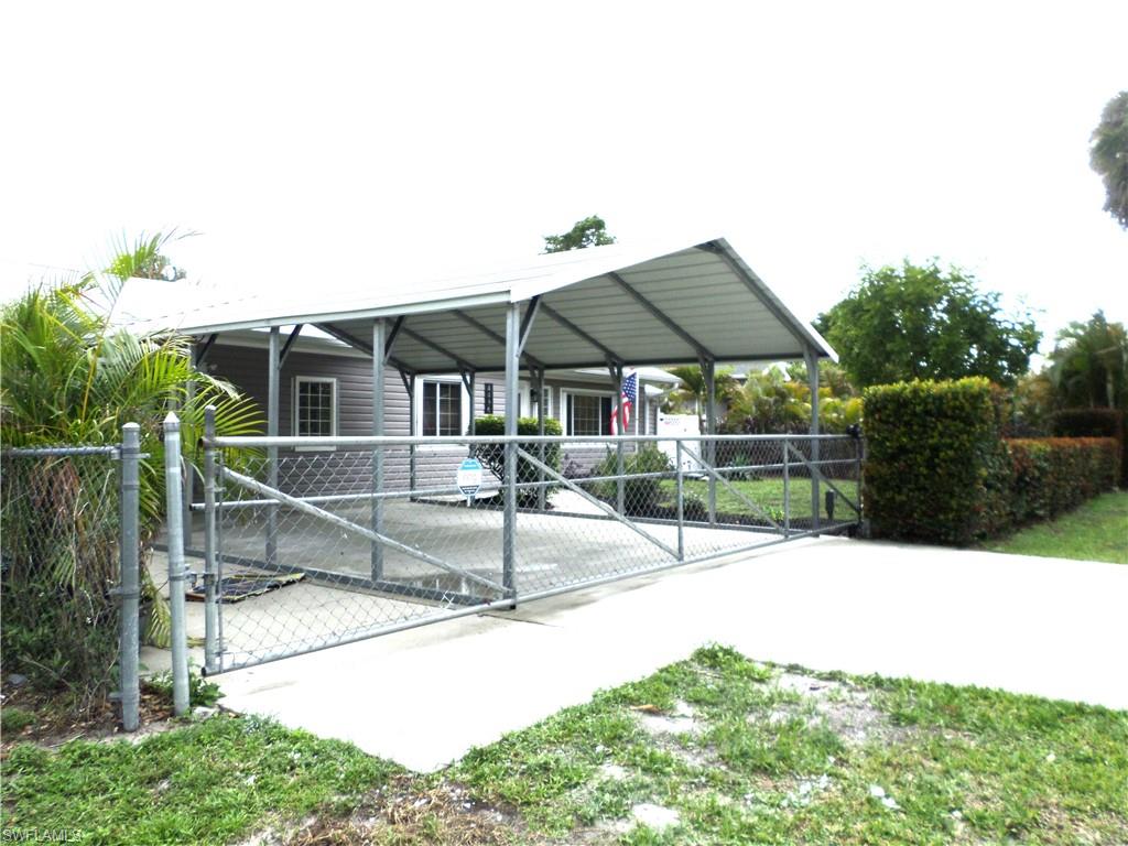 Double Over Size Attached Carport With Cement Driveway.