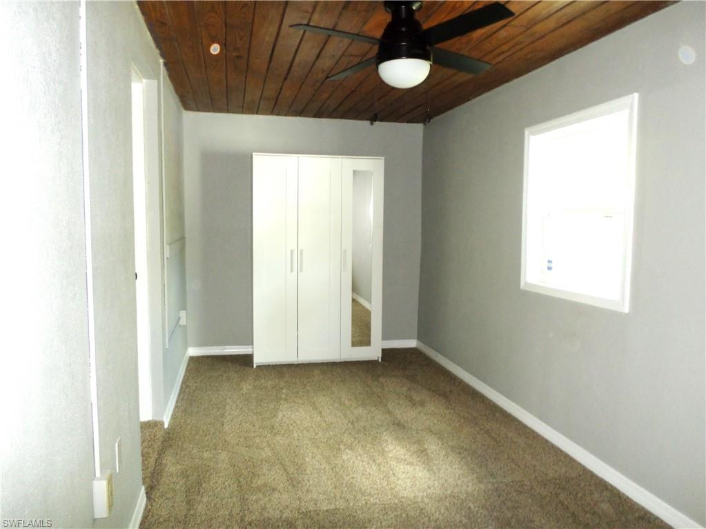 Nice Size 3rd Bedroom With Window & An Armoire With Full Length Mirror.