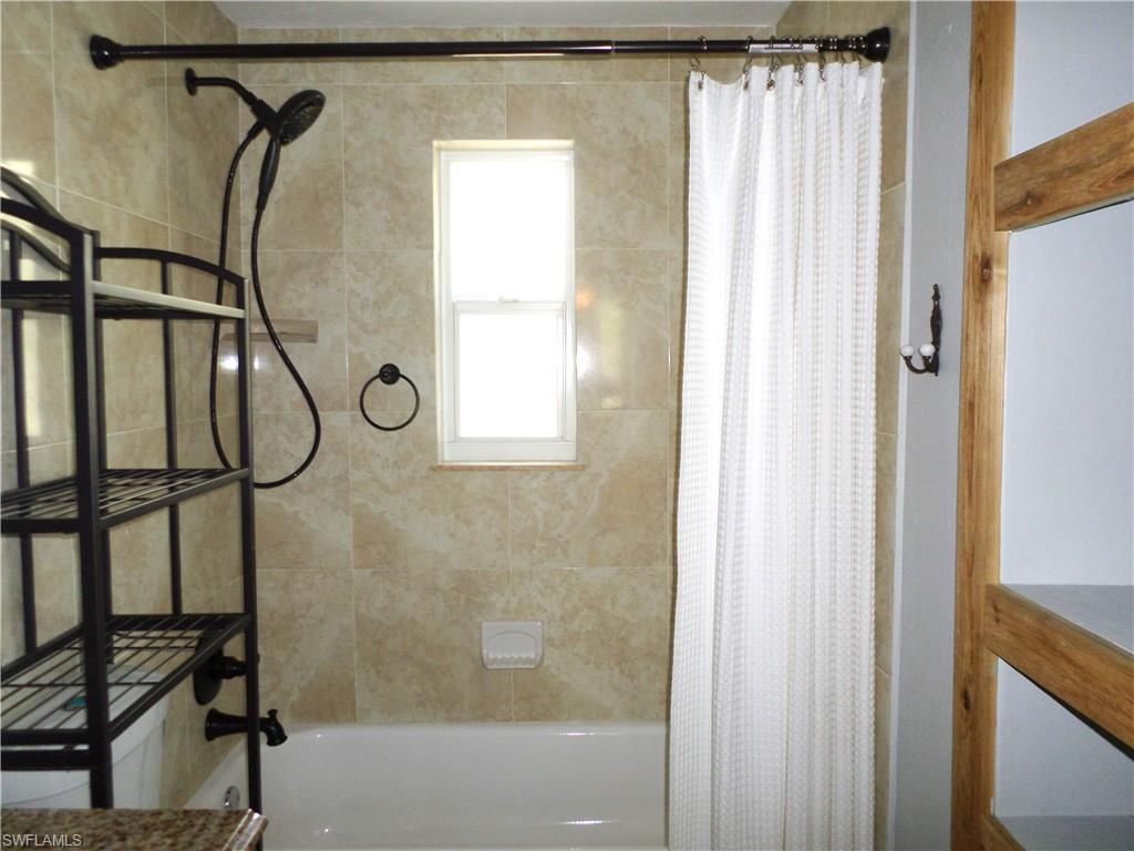 Updated Full Bathroom With Storage Shelves For Your Bathroom Needs.