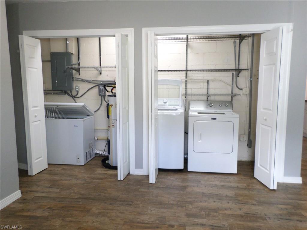 Laundry Area With An Extra Freezer included & Water Heater Area.