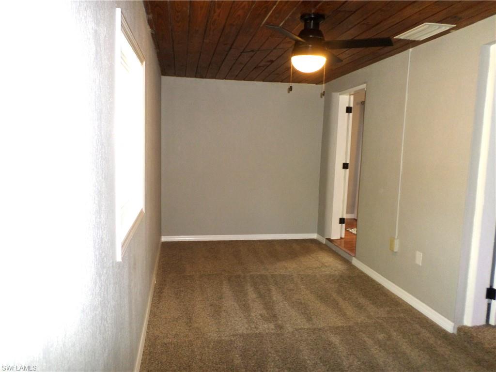 Nice Size 3rd Bedroom With Window & An Armoire With Full Length Mirror.
