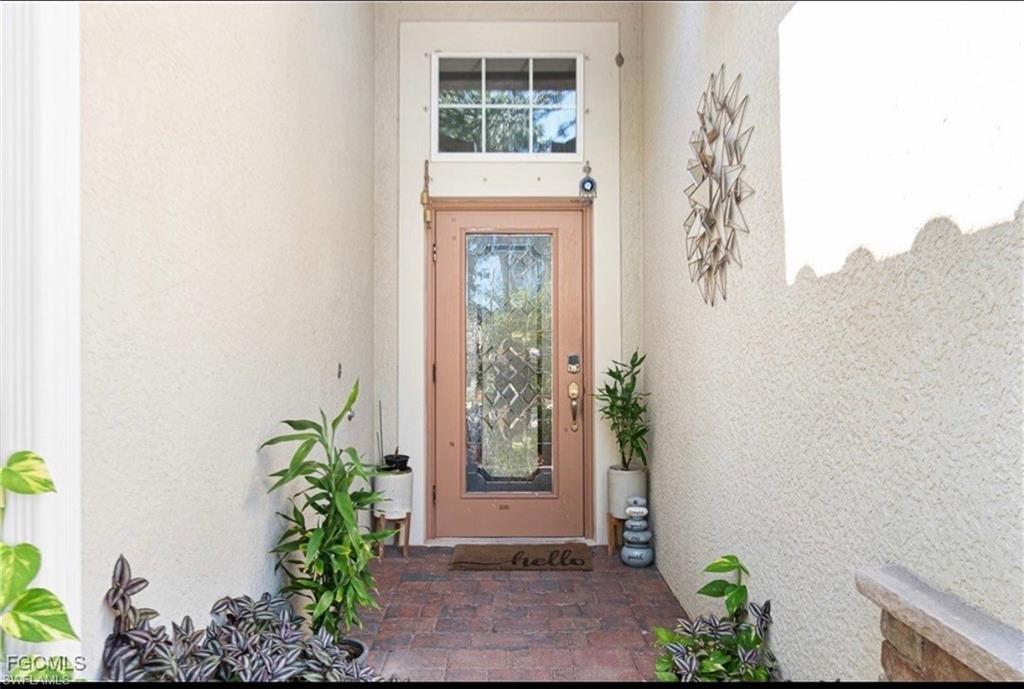 Property entrance with stucco siding