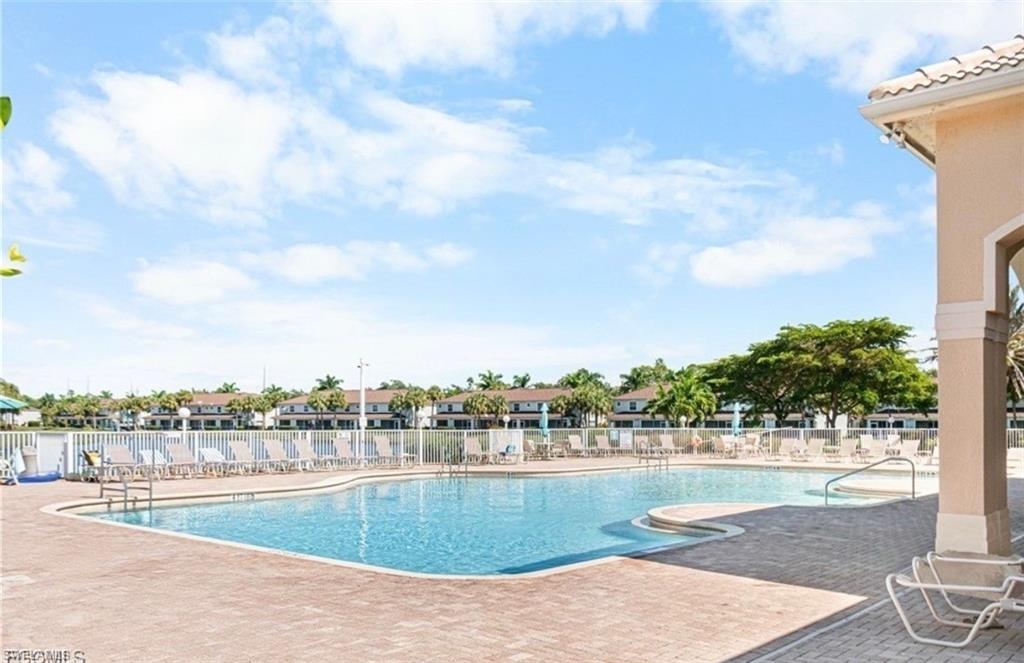 Community pool with a patio area