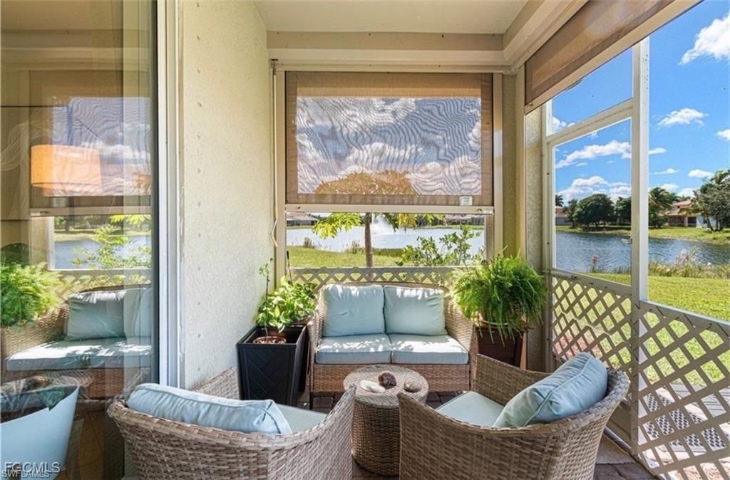 Sunroom / solarium with an outdoor lounge area and a water view