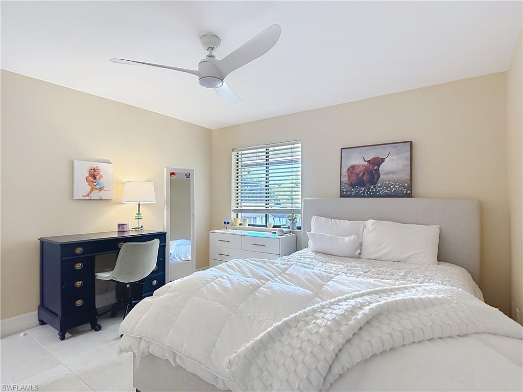Cozy bedroom with natural light and comfortable layout.