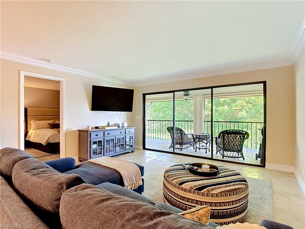 Spacious living room filled with natural light and comfortable layout.