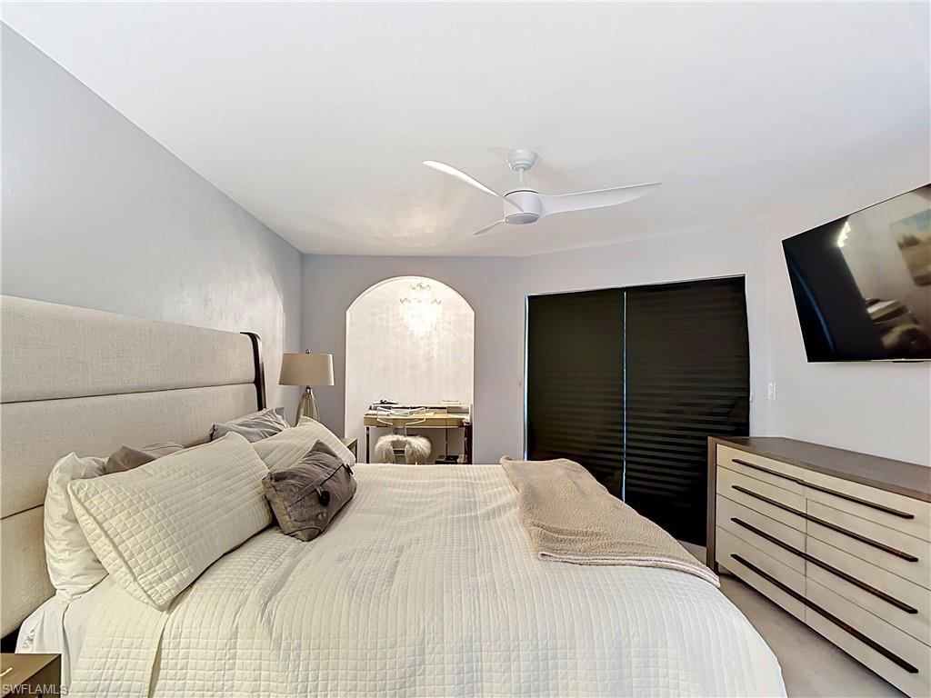Spacious bedroom with neutral tones and relaxing atmosphere.