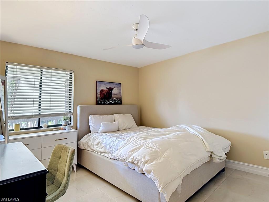 Bright bedroom with ample space and neutral finishes.