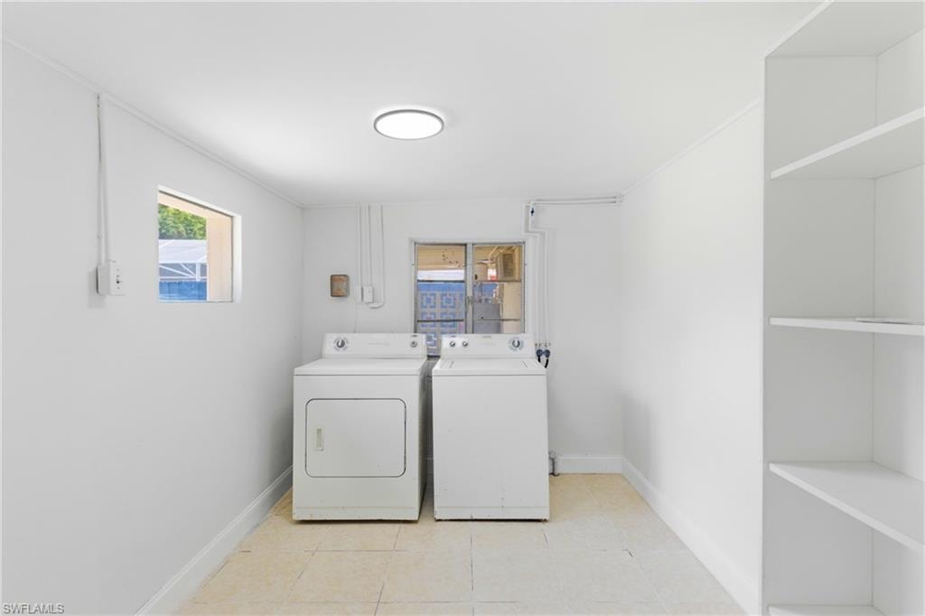 Dedicated laundry space featuring room for washer and dryer with added convenience and organization.