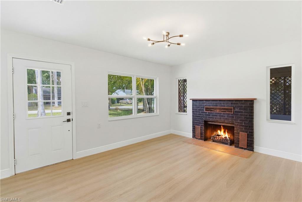 Warm and inviting living room featuring a cozy fireplace that serves as the focal point of the space, creating the perfect setting for relaxing or entertaining.