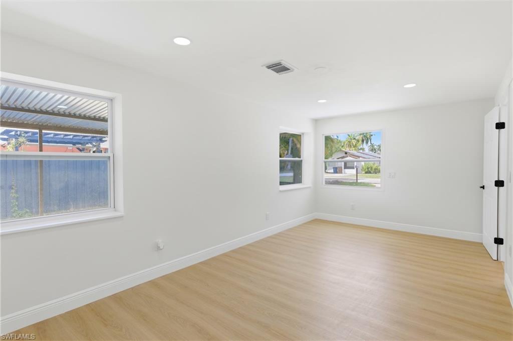 Comfortable primary bedroom with an open layout, creating a calm and restful space to unwind.