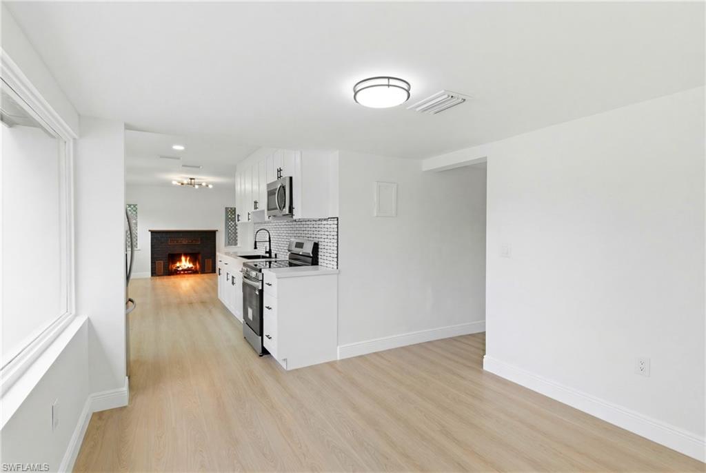 Open and inviting kitchen seamlessly connected to the dining area, creating a comfortable space for everyday meals and entertaining.