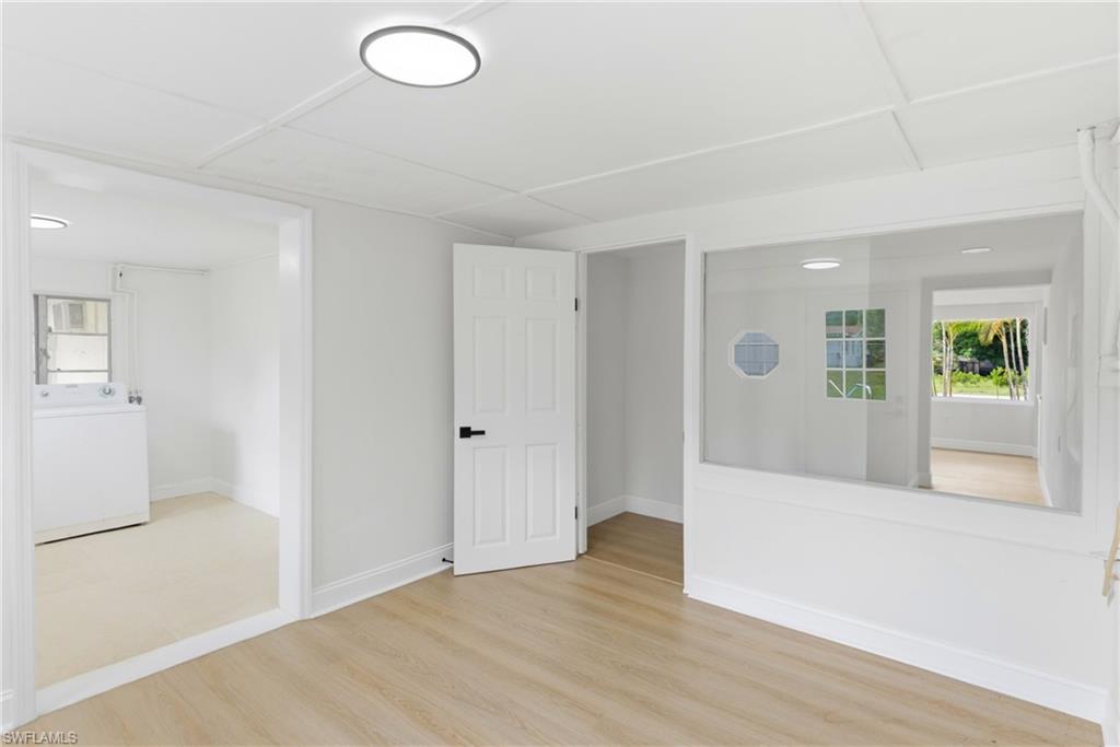 Comfortable den area providing seamless access to the laundry room, ideal for added functionality and organization.