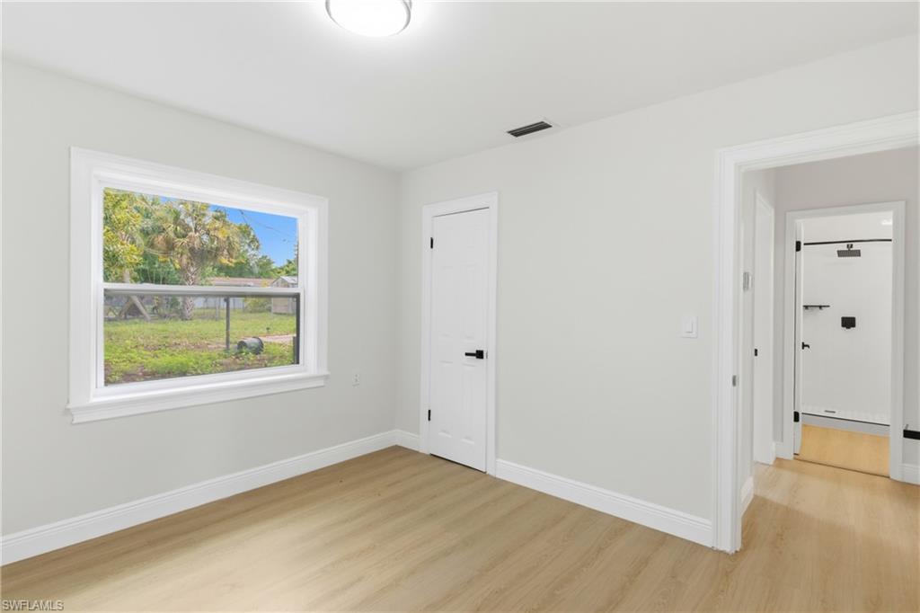 Inviting guest bedroom with natural light.