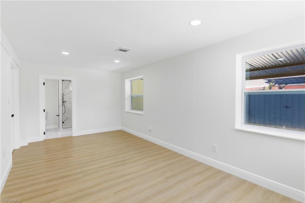 Well-appointed primary bedroom designed for comfort and privacy, featuring a generous layout ideal for rest and relaxation.