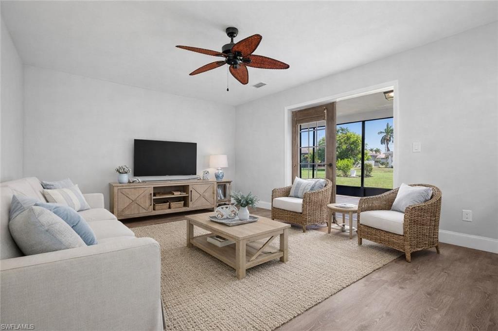 **VIRTUALLY STAGED** Family Room just steps from the screened lanai