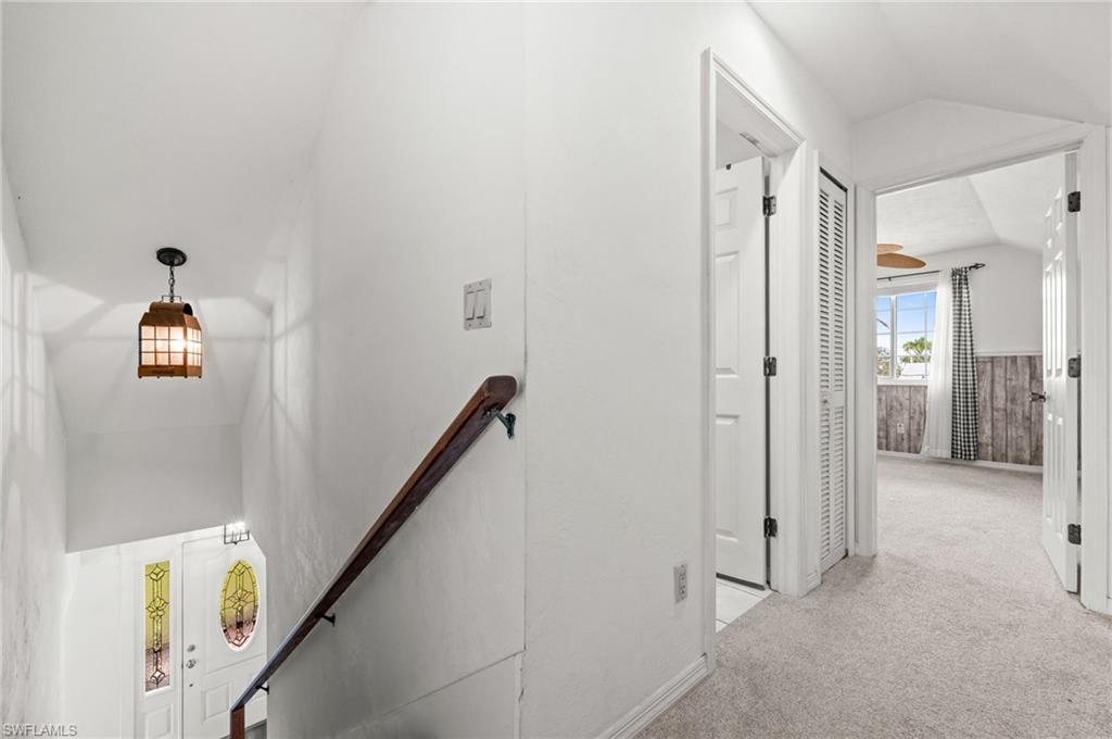 Hallway at the top of the stairs, overlooking bedroom 3 and the 2nd  bath