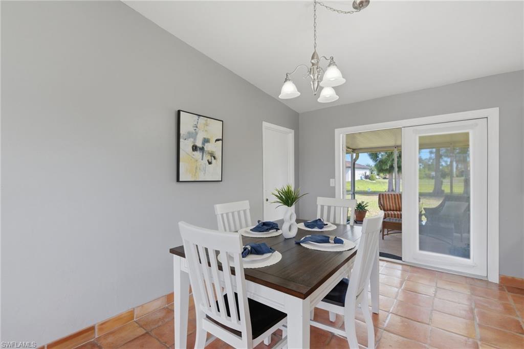 Dining area with french doors and view to the screened in lanai