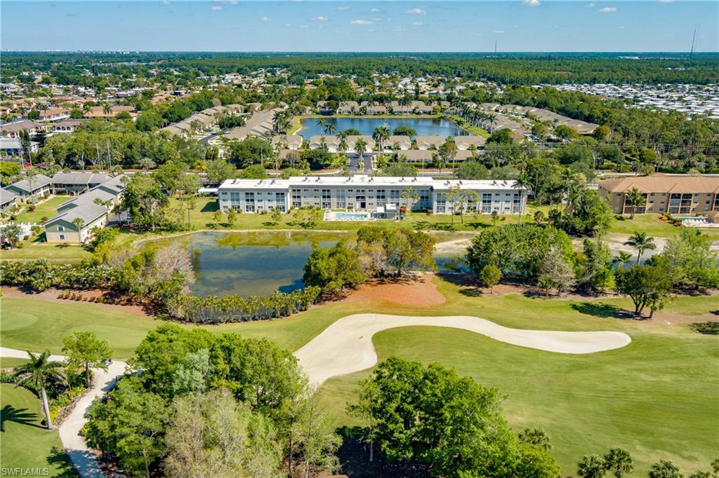 Birds eye view of property featuring a residential view, a water view, and golf course view
