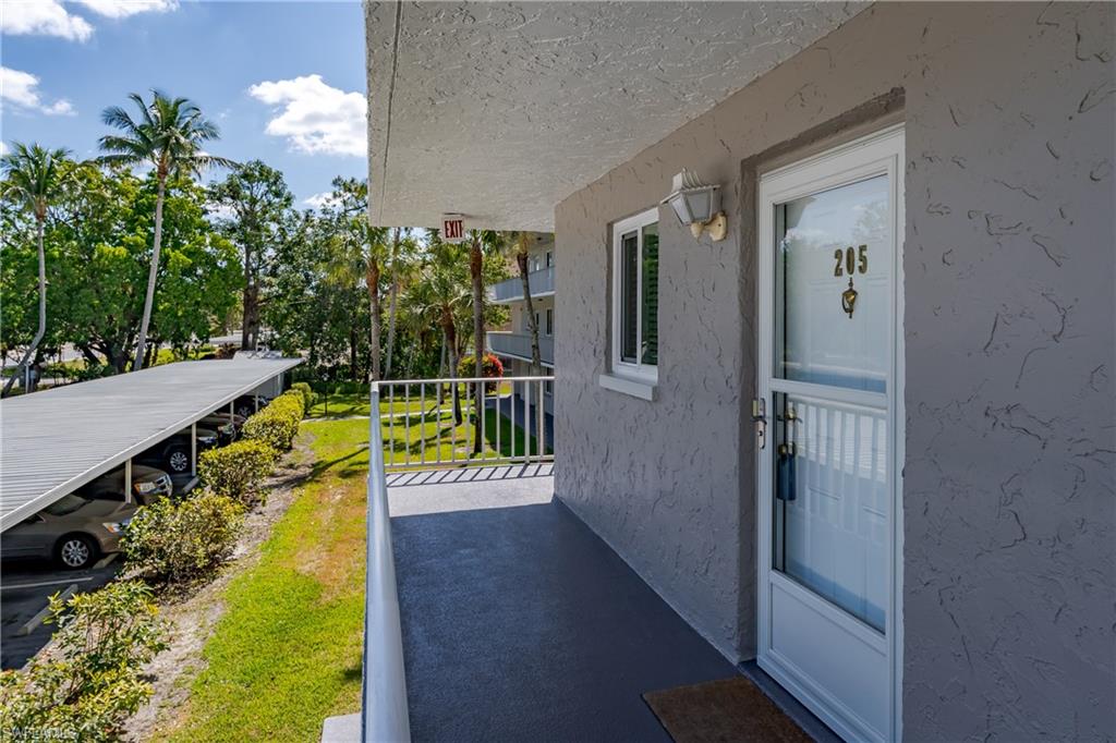 Property entrance with stucco siding